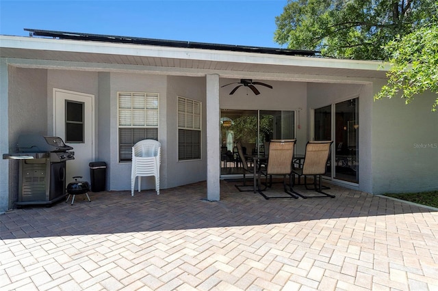 view of patio / terrace with ceiling fan, outdoor dining space, and area for grilling