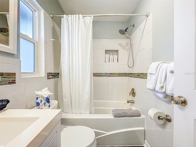 1600 Pasadena Dr, Dunedin, FL 34698 - bathroom featuring toilet, shower / bath combo, vanity, and tile walls