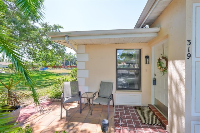319 Kelsey Way, Sun City Center, FL 33573 - exterior space with stucco siding and a patio
