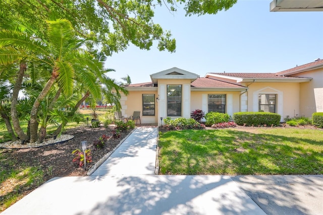 319 Kelsey Way, Sun City Center, FL 33573 - view of front of home featuring a front lawn and stucco siding