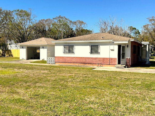 318 Banana St, Tarpon Springs, FL 34689 - ranch-style home with a garage, brick siding, and a front yard
