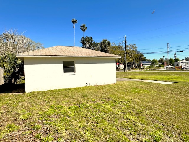 318 Banana St, Tarpon Springs, FL 34689 - view of property exterior featuring a yard and stucco siding
