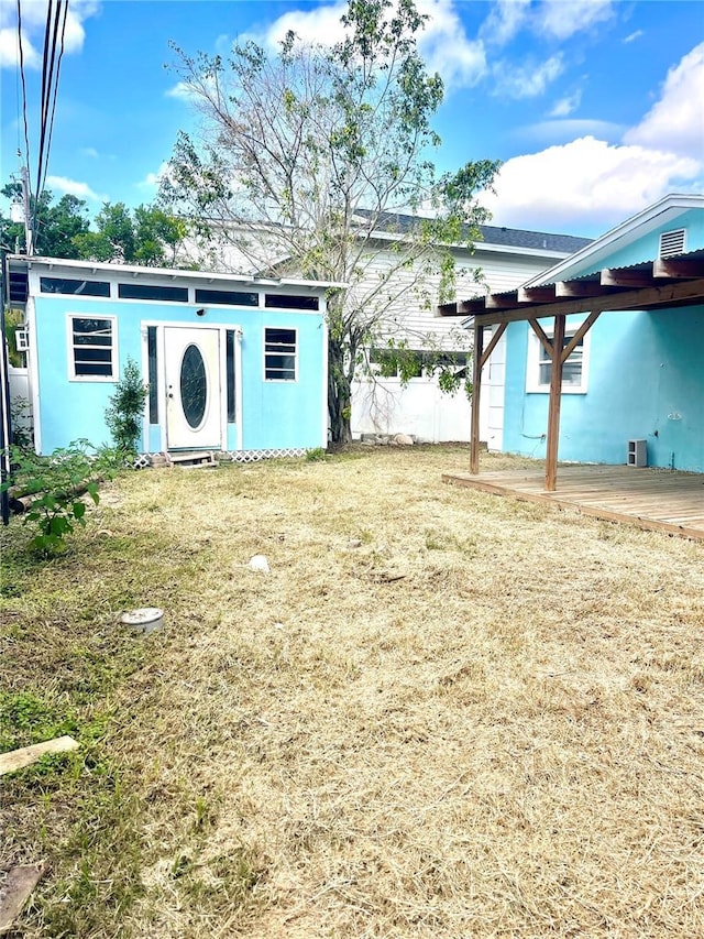 view of yard with a wooden deck and fence