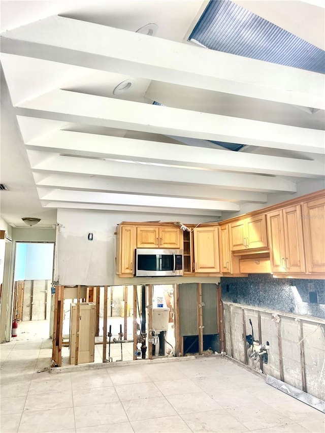 kitchen featuring stainless steel microwave