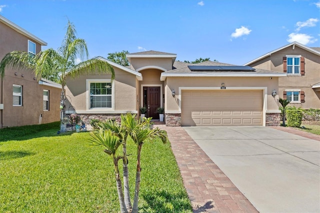 10514 Scenic Hollow Dr, Riverview, FL 33578 - view of front of property with stone siding, driveway, stucco siding, and a front lawn