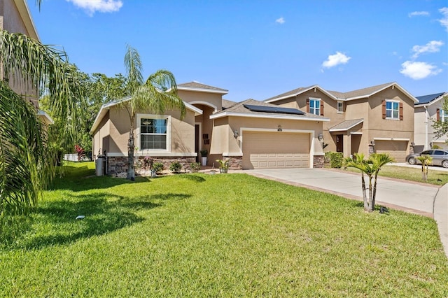 10514 Scenic Hollow Dr, Riverview, FL 33578 - view of front of home with stucco siding, stone siding, concrete driveway, solar panels, and a front yard