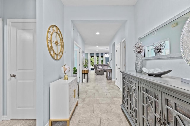 10514 Scenic Hollow Dr, Riverview, FL 33578 - hall with baseboards, light stone finish flooring, and recessed lighting