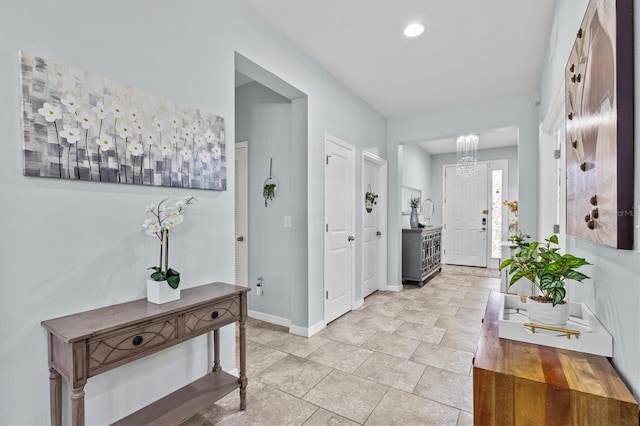 10514 Scenic Hollow Dr, Riverview, FL 33578 - entryway featuring baseboards and a chandelier