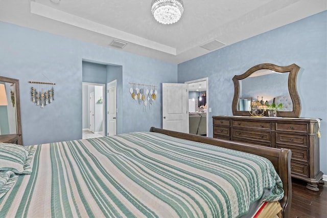 10514 Scenic Hollow Dr, Riverview, FL 33578 - bedroom featuring a raised ceiling, dark wood-type flooring, a chandelier, and baseboards
