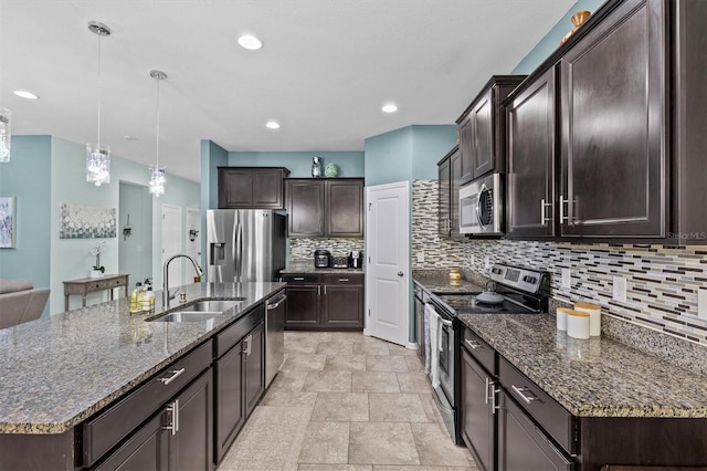 10514 Scenic Hollow Dr, Riverview, FL 33578 - kitchen with stainless steel appliances, a sink, dark brown cabinets, backsplash, and decorative light fixtures