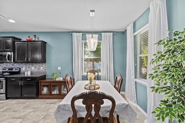 10514 Scenic Hollow Dr, Riverview, FL 33578 - dining area featuring a chandelier and recessed lighting