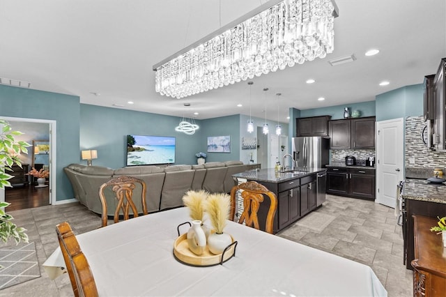 10514 Scenic Hollow Dr, Riverview, FL 33578 - dining space featuring a chandelier and recessed lighting