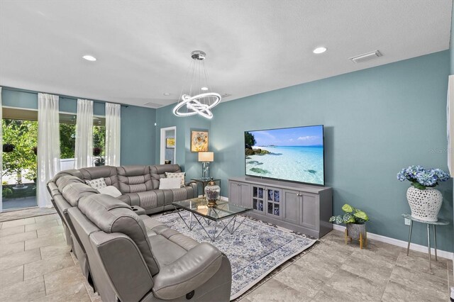 10514 Scenic Hollow Dr, Riverview, FL 33578 - living room with a chandelier, baseboards, and recessed lighting