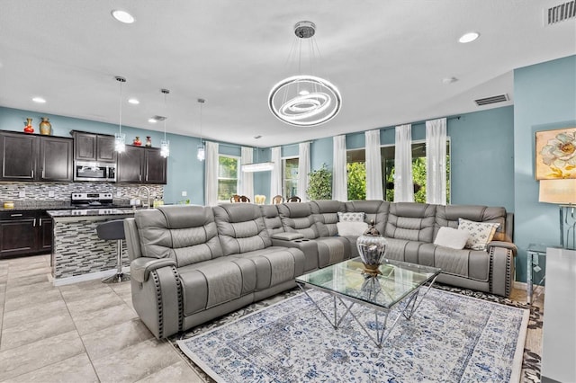 10514 Scenic Hollow Dr, Riverview, FL 33578 - living area featuring recessed lighting and a chandelier