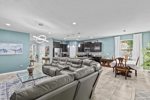 10514 Scenic Hollow Dr, Riverview, FL 33578 - living area with a chandelier, recessed lighting, and baseboards