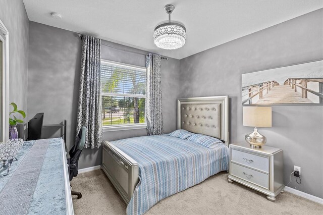 10514 Scenic Hollow Dr, Riverview, FL 33578 - bedroom with carpet floors, a chandelier, an office area, and baseboards