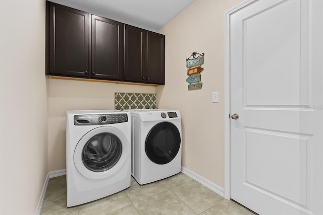 10514 Scenic Hollow Dr, Riverview, FL 33578 - clothes washing area featuring cabinet space, separate washer and dryer, baseboards, and light tile patterned floors