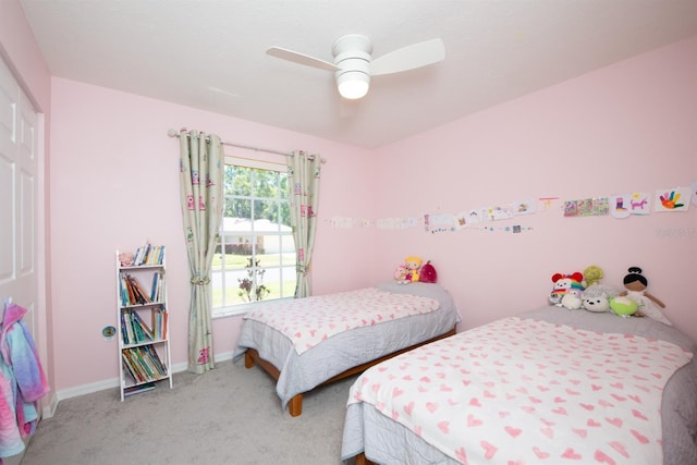 10321 Ravines Dr, New Port Richey, FL 34654 - carpeted bedroom with baseboards, a closet, and a ceiling fan