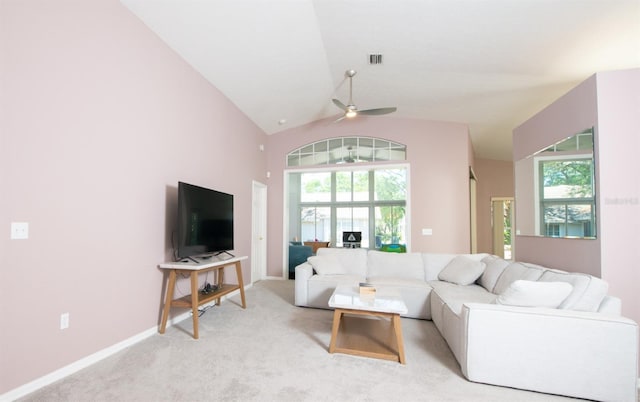 10321 Ravines Dr, New Port Richey, FL 34654 - living room featuring ceiling fan, light carpet, baseboards, and high vaulted ceiling
