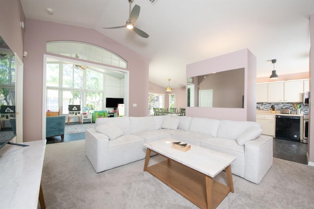 10321 Ravines Dr, New Port Richey, FL 34654 - living room with a ceiling fan, vaulted ceiling, and light colored carpet