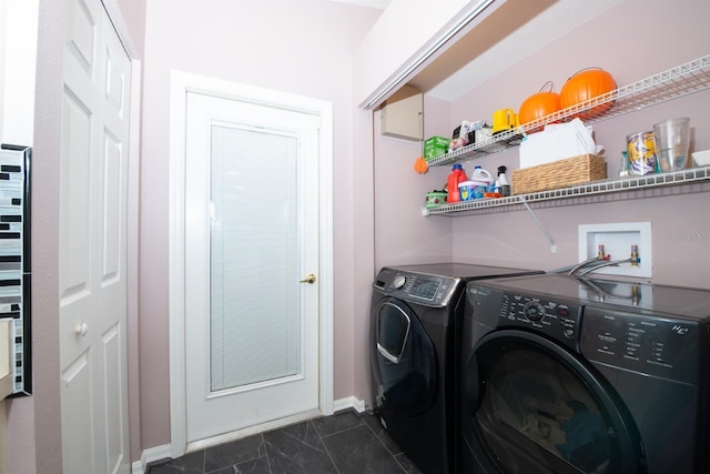 10321 Ravines Dr, New Port Richey, FL 34654 - laundry area featuring washing machine and clothes dryer, baseboards, and dark marble finish floors