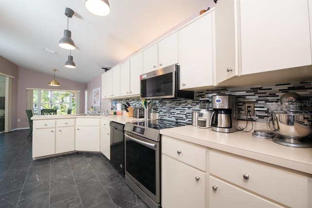 10321 Ravines Dr, New Port Richey, FL 34654 - kitchen featuring appliances with stainless steel finishes, a peninsula, vaulted ceiling, light countertops, and backsplash