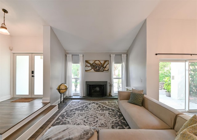 4520 Wescott Ln, Tampa, FL 33624 - living area with a wealth of natural light, french doors, wood finished floors, and a fireplace