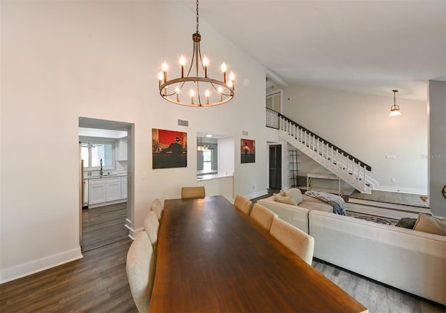 4520 Wescott Ln, Tampa, FL 33624 - dining space with dark wood-style flooring, a chandelier, stairs, and visible vents