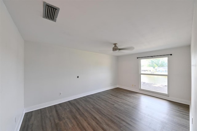 4520 Wescott Ln, Tampa, FL 33624 - spare room featuring baseboards, visible vents, dark wood-style floors, and ceiling fan
