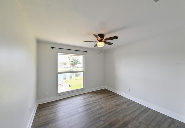 4520 Wescott Ln, Tampa, FL 33624 - empty room featuring baseboards, a ceiling fan, and dark wood-style floors