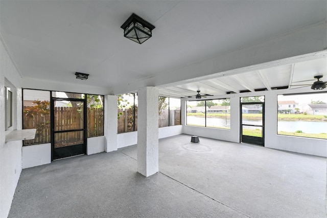 4520 Wescott Ln, Tampa, FL 33624 - unfurnished sunroom featuring beam ceiling and ceiling fan