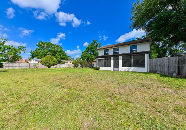 4520 Wescott Ln, Tampa, FL 33624 - view of yard with a fenced backyard and a sunroom