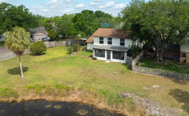 4520 Wescott Ln, Tampa, FL 33624 - view of yard with a fenced backyard and a sunroom