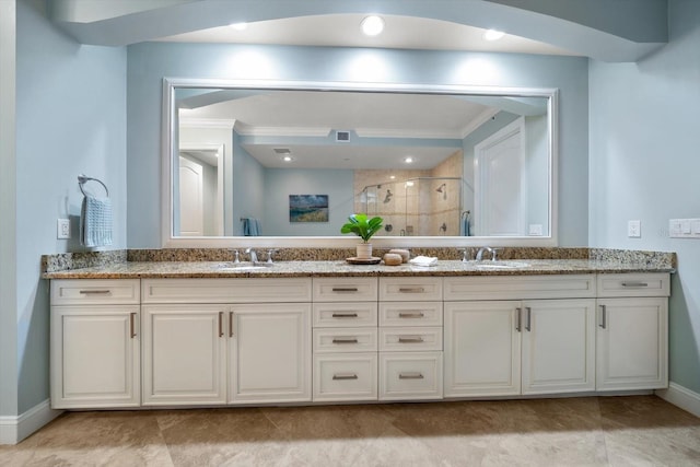 202 Windward Psge Unit 304, Clearwater Beach, FL 33767 - bathroom with double vanity, a stall shower, and crown molding