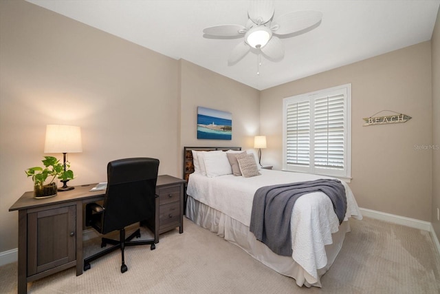 202 Windward Psge Unit 304, Clearwater Beach, FL 33767 - bedroom featuring light colored carpet, a desk, and ceiling fan