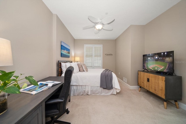 202 Windward Psge Unit 304, Clearwater Beach, FL 33767 - bedroom with light colored carpet, an office area, and a ceiling fan