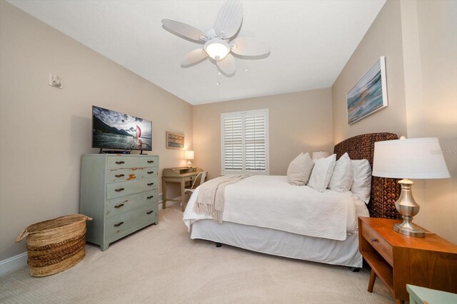 202 Windward Psge Unit 304, Clearwater Beach, FL 33767 - bedroom with light carpet and a ceiling fan