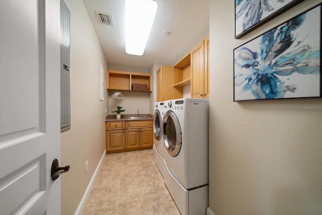202 Windward Psge Unit 304, Clearwater Beach, FL 33767 - laundry room with washer and dryer and cabinet space
