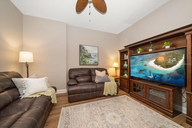 202 Windward Psge Unit 304, Clearwater Beach, FL 33767 - living room featuring wood finished floors and ceiling fan