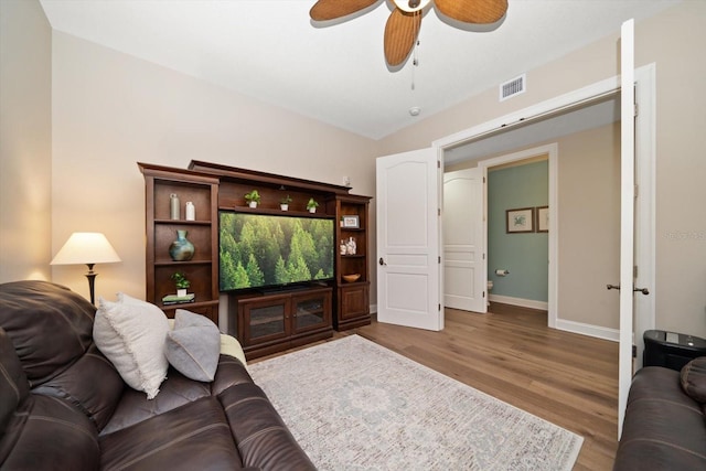 202 Windward Psge Unit 304, Clearwater Beach, FL 33767 - living area featuring wood finished floors and ceiling fan
