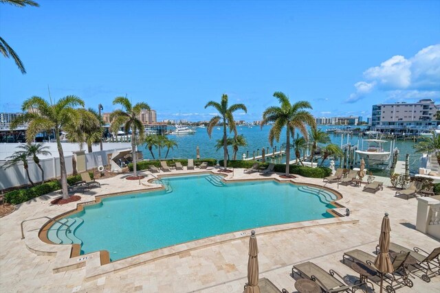 202 Windward Psge Unit 304, Clearwater Beach, FL 33767 - community pool with a patio and a water view