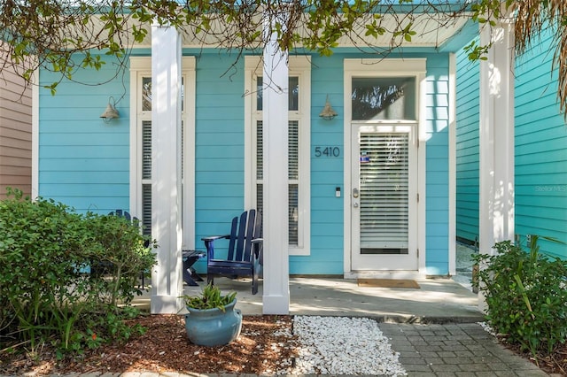 entrance to property with a porch