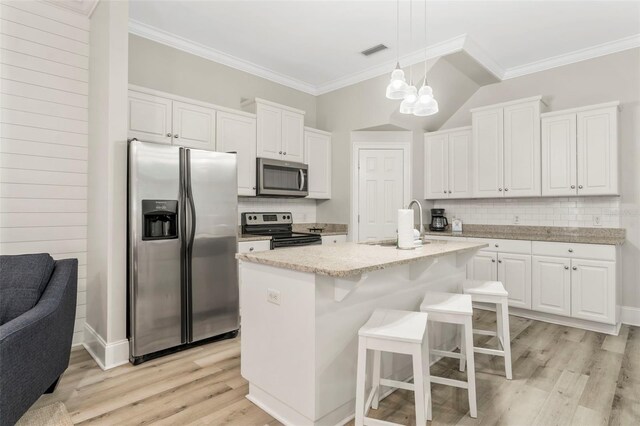 kitchen with white cabinetry, light wood-style flooring, visible vents, stainless steel appliances, and a notable chandelier