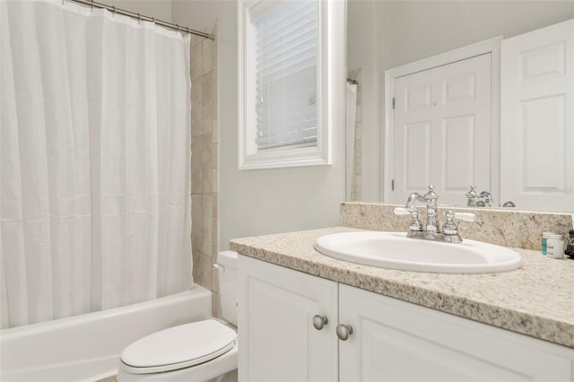 bathroom with vanity, toilet, and shower / tub combo with curtain