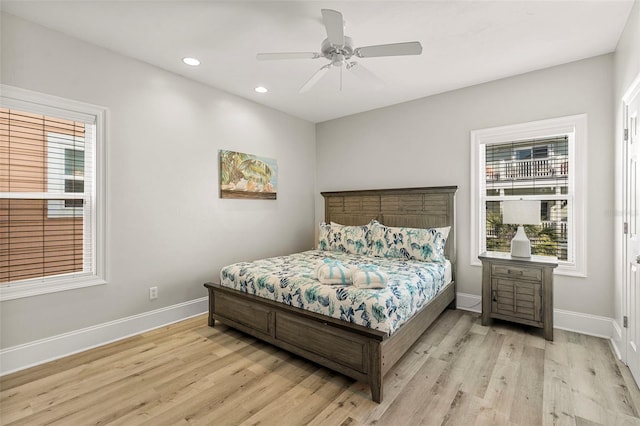 bedroom with baseboards, light wood-type flooring, a ceiling fan, and recessed lighting