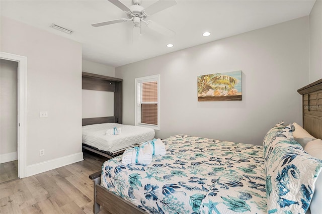 bedroom with recessed lighting, a ceiling fan, visible vents, baseboards, and wood finished floors