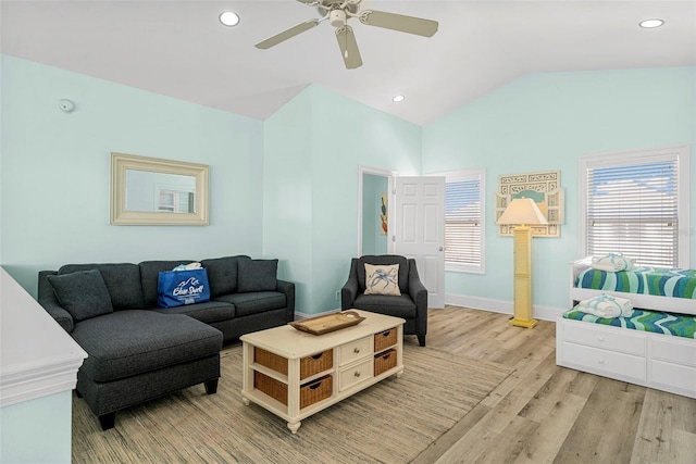 living room featuring recessed lighting, a ceiling fan, lofted ceiling, and light wood finished floors