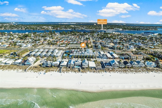 bird's eye view with a residential view, a view of the beach, and a water view