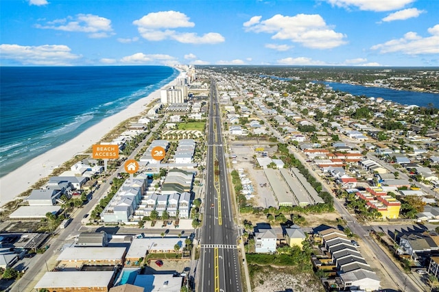 drone / aerial view with a water view, a residential view, and a view of the beach
