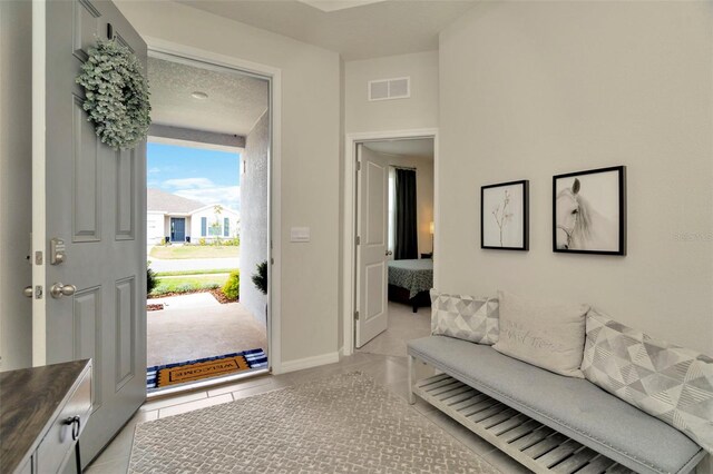 3504 Golden Wheat Ln, Plant City, FL 33565 - entrance foyer featuring light tile patterned floors and baseboards